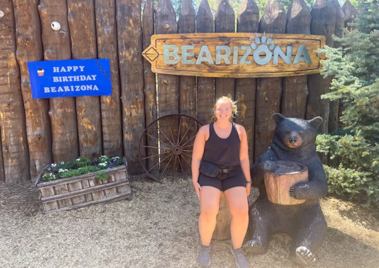 Woman posing in front of Bearizona Wildlife Park sign in Arizona