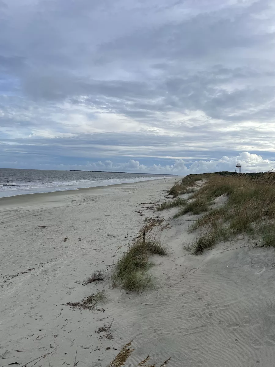 beach with cloud-covered sky 