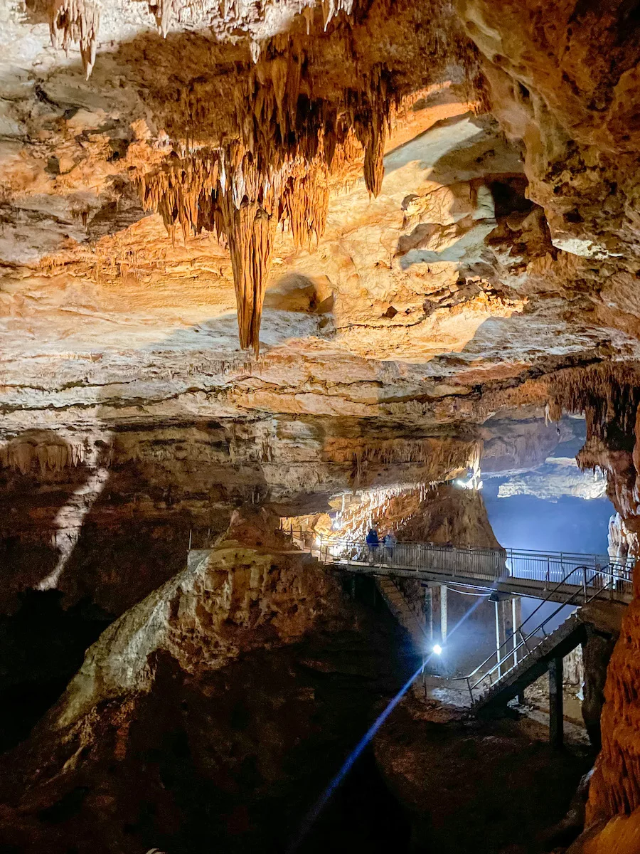 Inside of Onondaga Cave State Park showcasing the beautiful cave formations and the walkways. 