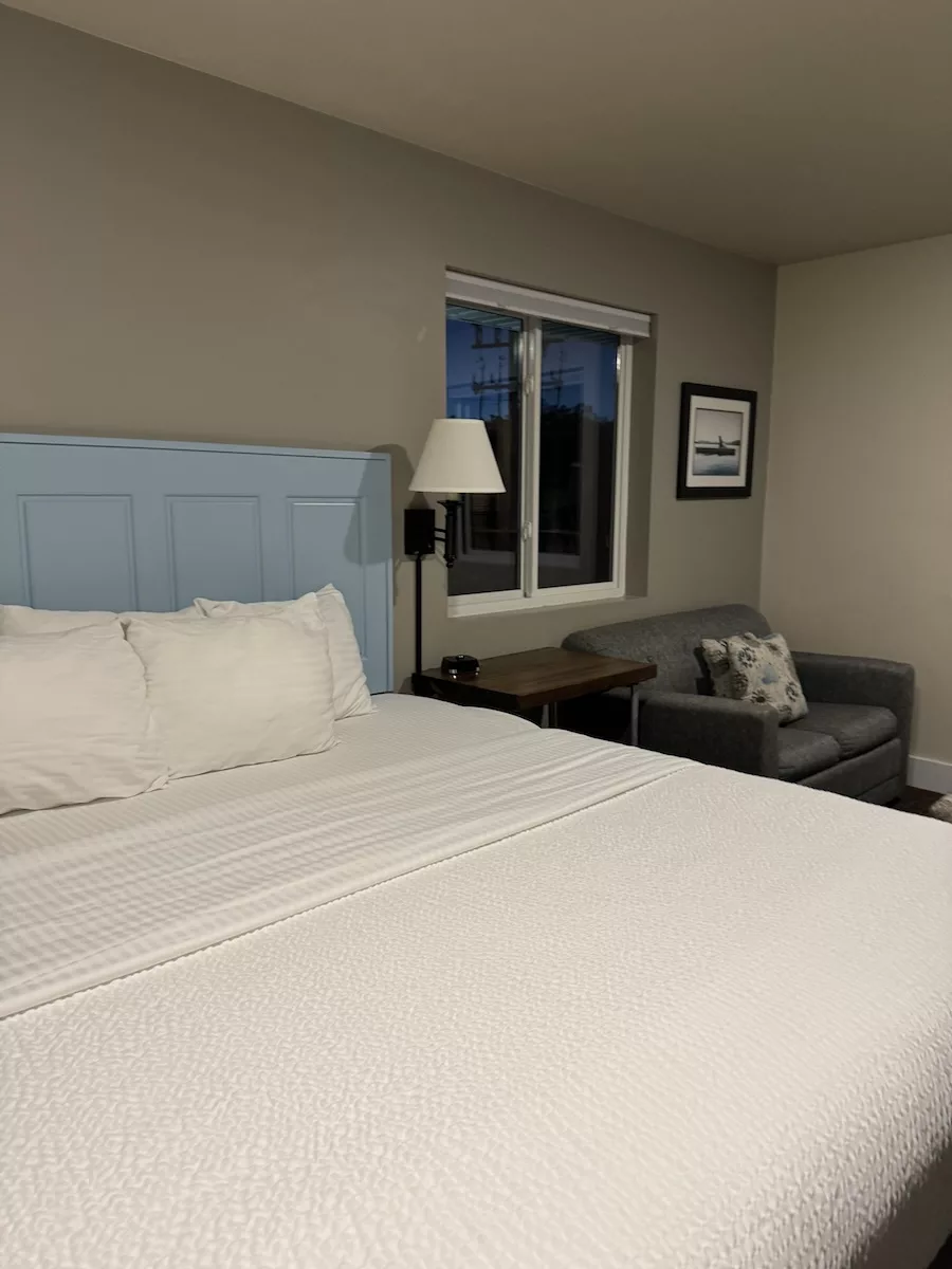 View of bed and pull-out couch at Julie's Park Cafe and Motel in Fish Creek