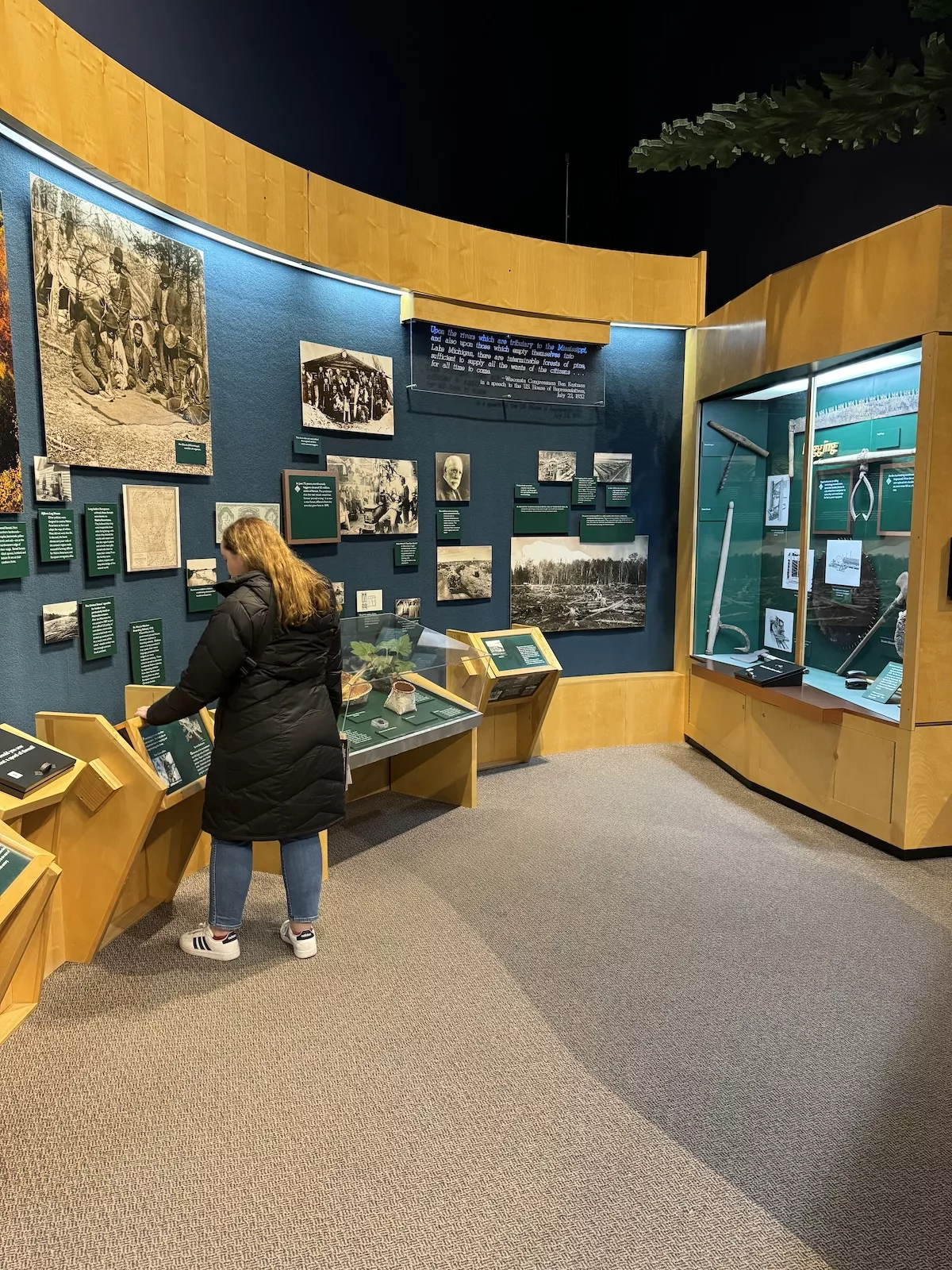 Woman engaging in the interactive activities at the Northern Great Lakes Visitor Center