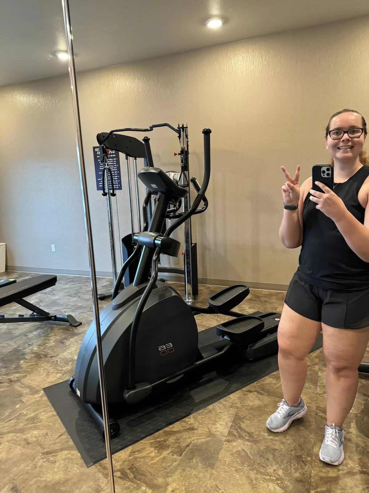 Young woman working out in the fitness room at Cobblestone Inn - Ashland, WI