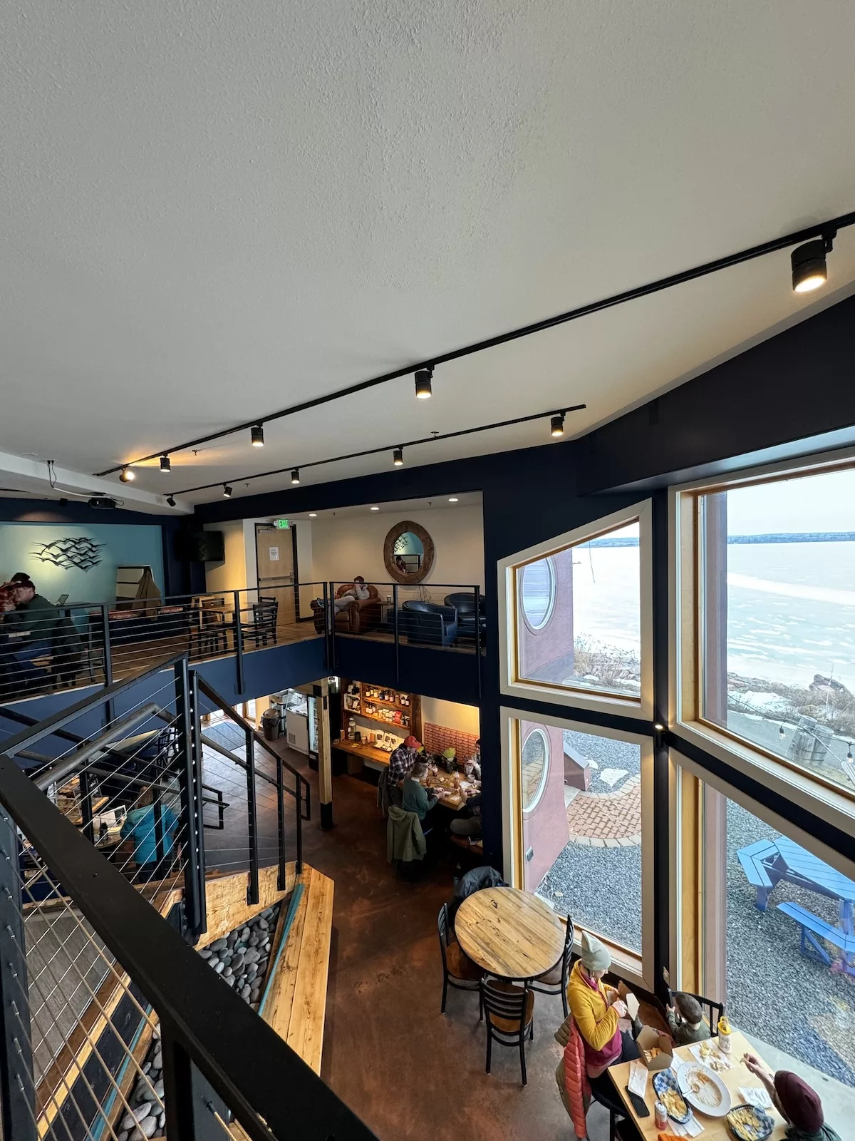 Image of upstairs seating area and large windows at the Sandbar, Ashland