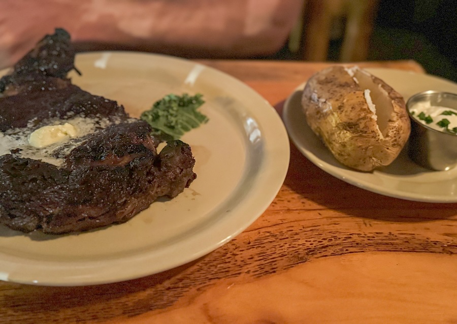 Image of a steak and large baked potato at Ishnala Supper Club in Lake Delton, WI
