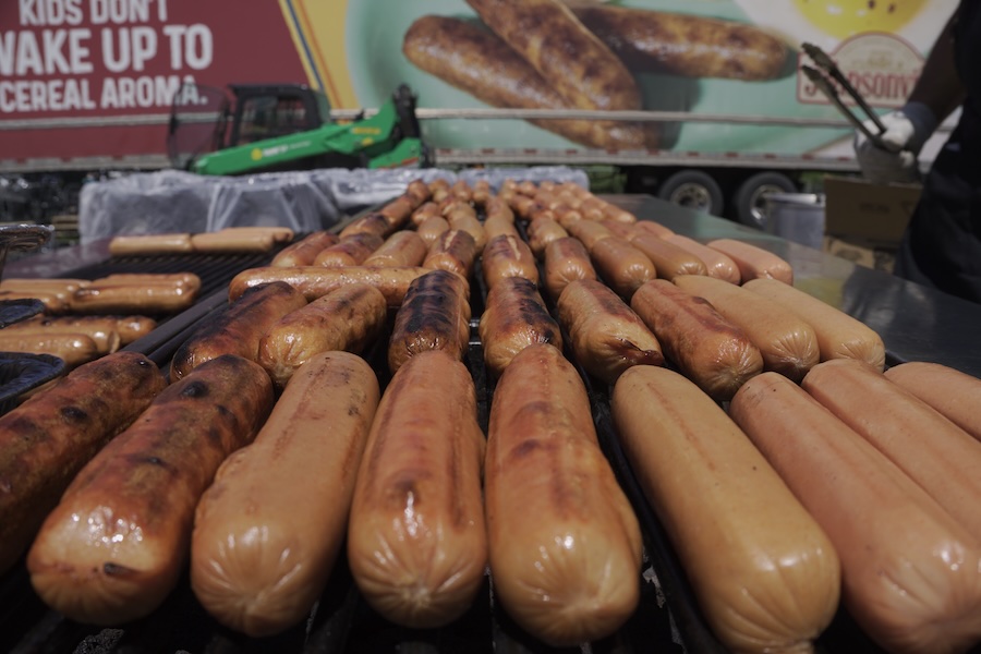 Image of brats on a grill at brat fest in Madison, WI