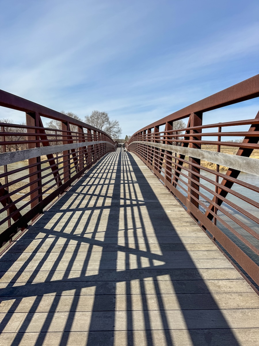Steel and wood bridge crossing the Platte River at the Crane Trust Nature Center in Nebraska.